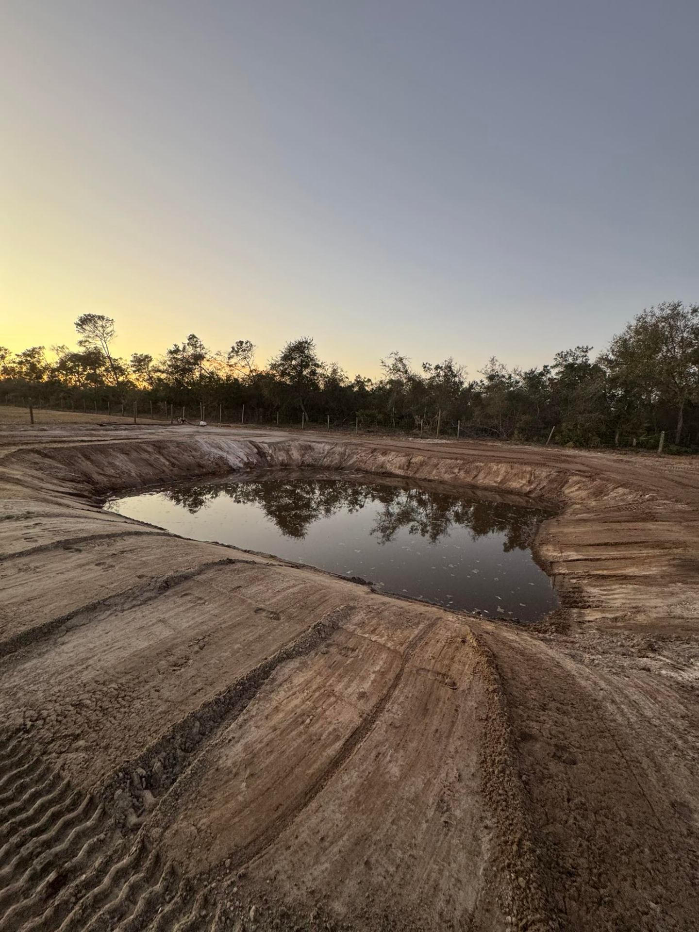 Pond excavation project at sunset in Volusia County, FL